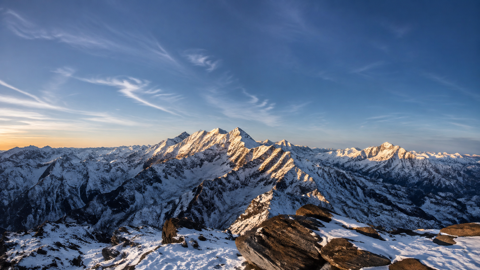 Snow-Covered Mountain Range at Sunrise 4K Desktop Wallpaper - pixora4k.com